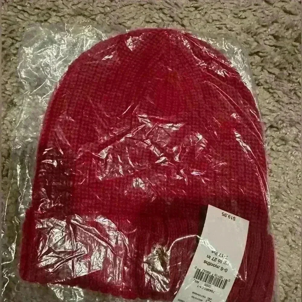 Brand new baby beanie in packaging.